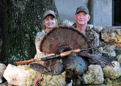 Couple with a Turkey at Triple Tree Ranch